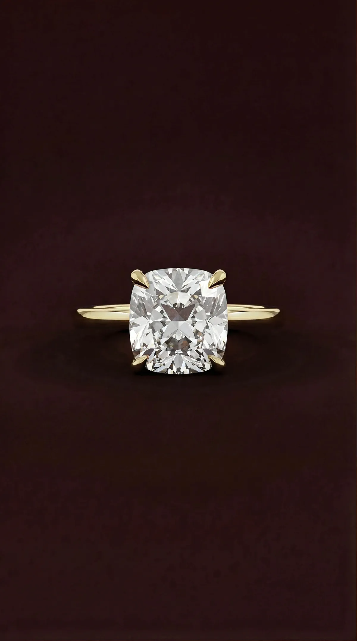Cushion cut lab-grown diamond solitaire engagement ring with four claws in yellow gold, by Lily Dia Jewellery