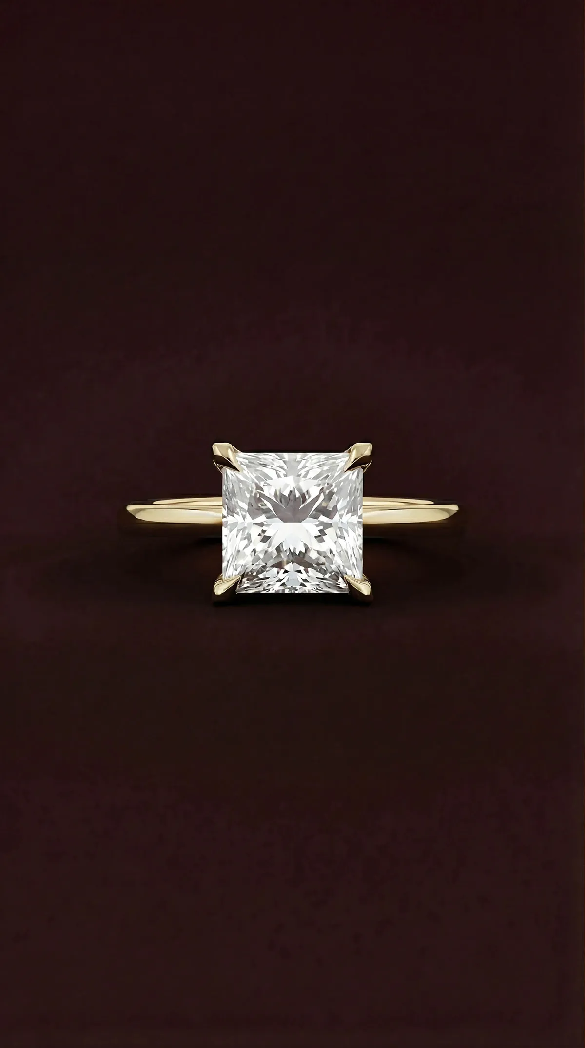 Princess cut lab-grown diamond solitaire engagement ring with four claws in yellow gold, by Lily Dia Jewellery